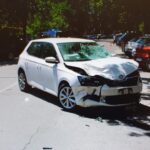 Via Laura Bassi Veratti, auto contro scooter: due giovani feriti